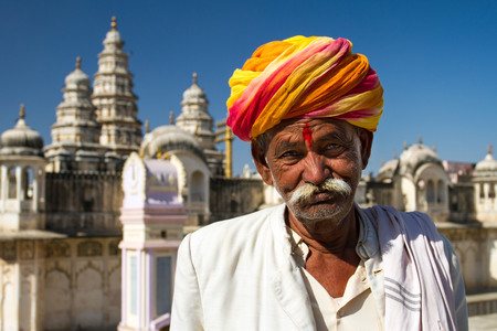 PUSHKAR, INDIA - DECEMBER 1: A Rajasthani man wearing traditional colorful turban posing after...