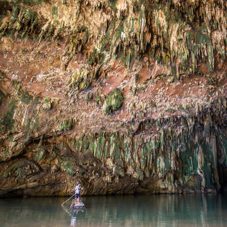 SAPPONG, THAILAND - DECEMBER 12, 2014. Man on a raft in front of beautiful Lod cave on December 12, 2014 in Sappong, Northern Thailandのeditorial素材