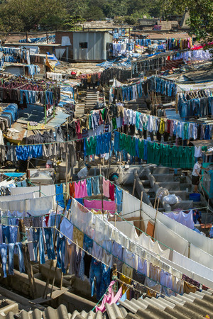 MUMBAI - 12 DECEMBER 2012: People at Dhobi Ghat, the world's largest outdoor laundry on December 12, 2012 in Mumbai, India.のeditorial素材