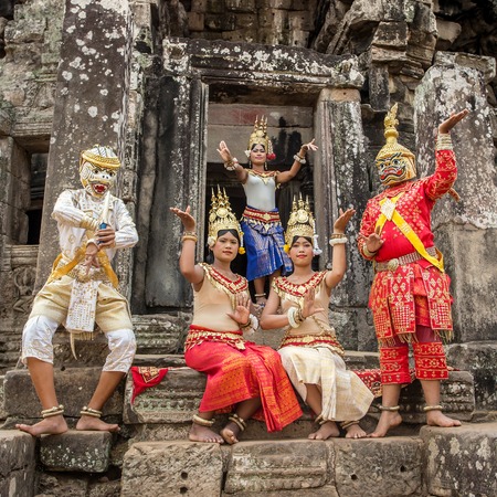 SIEM REAP, CAMBODIA-MARCH 15, 2014:An unidentified cambodians in national dress poses for tourists in Angkor Wat,on March 15, 2014, Siem Reap, Cambodia. Angko r is the country's prime attraction for visitors.のeditorial素材