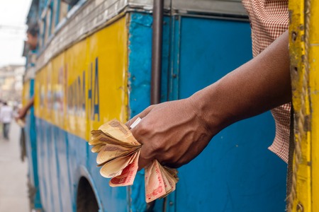Man holding Indian rupee notesの写真素材