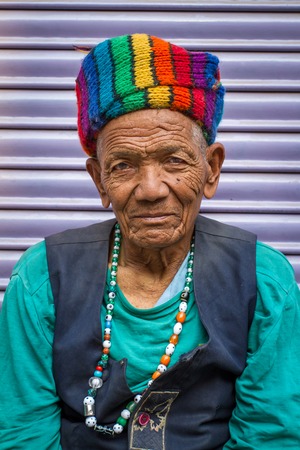 KATHMANDU, NEPAL - APRIL 2 - Portrait of an unidentified man with nice rainbow hat on APRIL 2, 2014, Nepal.のeditorial素材