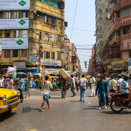 KOLKATA, INDIA - MARCH 13: Big city street with thousands of people, bikes and the buses on March 13, 2013 in Kolkata, India. Kolkata has a density of 814.80 vehicles per km road length.のeditorial素材