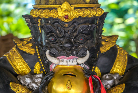 Demon guardian statue at Buddhist temple in Wat Tham Sua, Kanchanaburi, Thailandの写真素材