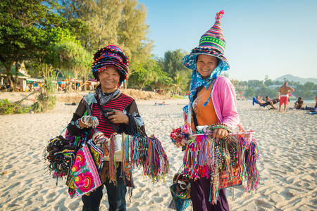 Phuket, Thailand - January 24,2015: Thai women selling beachwear and souvenirs at beach in Phuket, Thailand.のeditorial素材