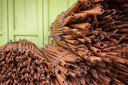 Big banch of cinnamon sticks on the storage