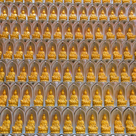 Golden buddha statue pattern backgroundの写真素材