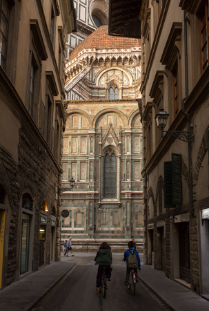 FLORENCE - SEPTEMBER 16: View the Duomo, Famous Santa Maria del Fiore cathedrall  from a street on September 16, 2015 in Florence. It was begun in 1296 and completed in 1436 with the dome engineered by Filippo Brunelleschi. Firenze, Italyのeditorial素材