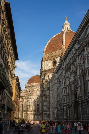 FLORENCE - SEPTEMBER 15: View the Duomo, Famous Santa Maria del Fiore cathedrall  from a street on September 15, 2015 in Florence. It was begun in 1296 and completed in 1436 with the dome engineered by Filippo Brunelleschi. Firenze, Italyのeditorial素材