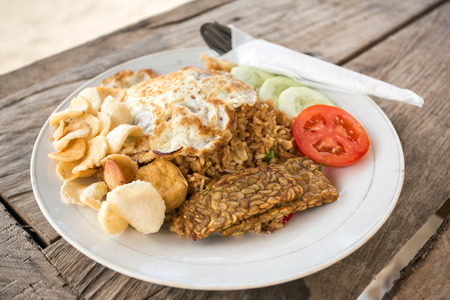 Traditional Nasi Goreng with fried egg and tempeの写真素材