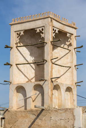 Badgir, the ancient windcatcher, on the roof of old house in Bandar-e Loft, Qeshm island, Iranの写真素材