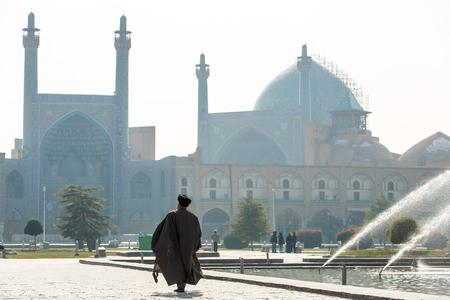 Esfahan, Iran - December 13, 2015: Unidentified Mullah walk towards the Shah Mosque in Isfahan, Iran.のeditorial素材
