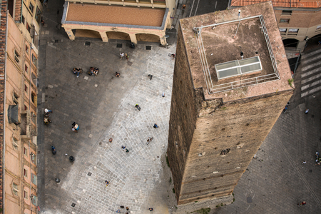 Aerial view of red tiled rooftops and ancient «Due Torri» towers in historical center of Bologna, Italyの写真素材