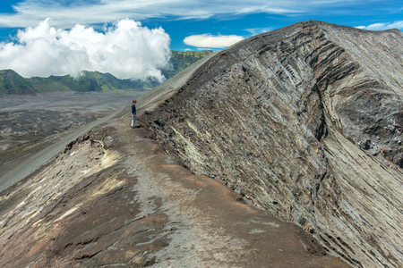 Tourist on the crater of Bromo volcano, Java island, Indonesiaの写真素材