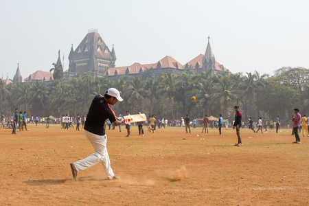 Mumbai, India - February 2, 2016: Unidentified man playing cricket in Mumbai Indiaのeditorial素材