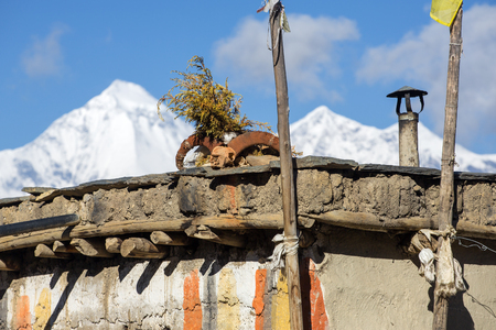 Ram skull on the house roof in Lower Mustang region in Nepalの写真素材