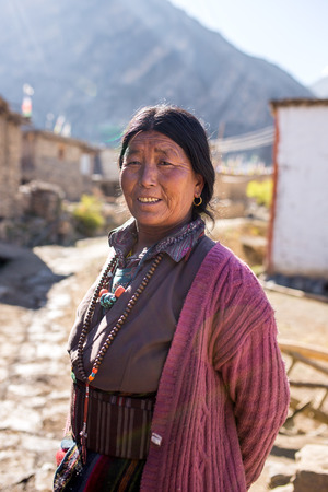 Jhong, Nepal - May 13, 2016: Portrait of an unidentified tibetan woman in the Himalayas mountains in Jhong village, Nepal.のeditorial素材