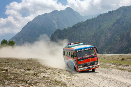 Dana, Nepal - May 15, 2016: Local nepalese bus driving crazy in the countryside of Himalayan region of Nepal.のeditorial素材