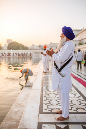 Amritsar, India - March 30, 2016: Unidentified sikh man praying near Golden temple in Amritsarのeditorial素材