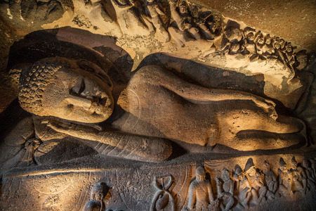 Reclining Buddha in chaitya-griha or prayer hall in Cave 26. Part of 29 rock-cut Buddhist cave monuments at Ajanta Caves. Part of UNESCO World Heritage Site.のeditorial素材