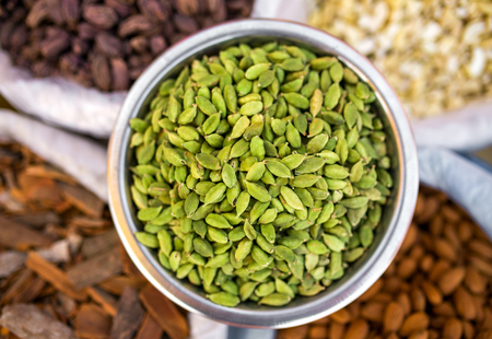 Various of Indian spices on the market in India. Cardamon seeds close-up.の写真素材