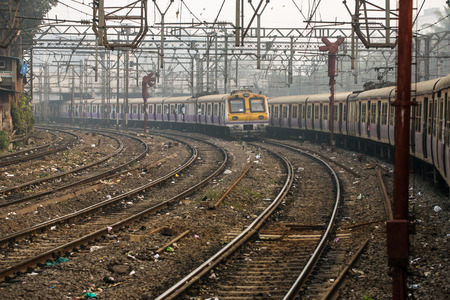 Mumbai, India - February 29, 2016: The local train running on one of the many railroads in Mumbai (Bombay), India.のeditorial素材
