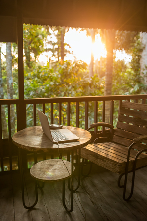 Freelancer working place in wooden Balinese house with a beautiful sunlightの写真素材