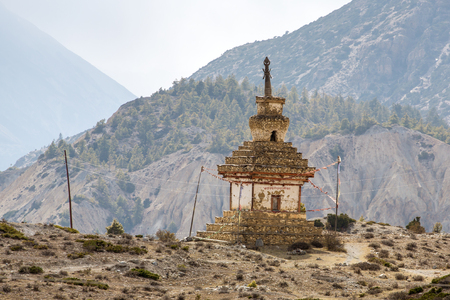 Traditional old Buddhist stupa on Annapurna Circuit Trek in Himalaya mountains, Nepal.の写真素材