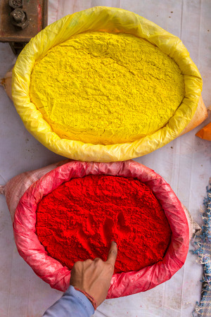 Colorful piles of powdered dyes used for Holi festival in Indiaの写真素材