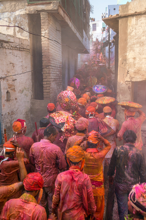 Nandgaon, India - March 18, 2016: Barsana villagers come to Nandgaon village to celebrate Lathmar Holi in Nandgaon, Uttar Pradesh, India.のeditorial素材
