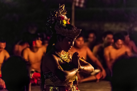 Ubud, Indonesia - August 8, 2016: Beautiful balinese woman dances during a traditional Kecak Fire Dance ceremony in Hindu temple.のeditorial素材