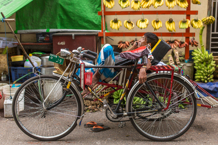 Yangon, Myanmar - September 26, 2016: An unidentified cycle rickshaw driver waits for tourists on the streets of Yangon in Myanmar.のeditorial素材