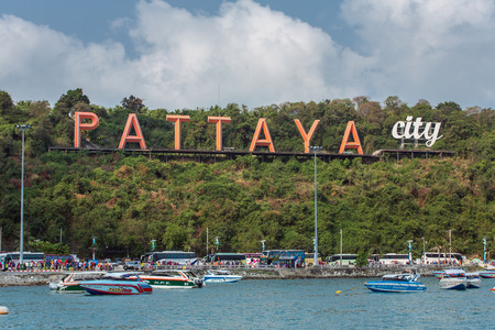 Pattaya, Thailand - March 7, 2017 : The famous Pattaya city sign on the hill at Pattaya bay with commerical boats and speed boats.のeditorial素材