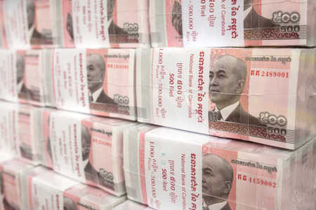 Phnom Penh, Cambodia - March 28, 2017: Stacks of 100 riel banknotes from Cambodiaのeditorial素材