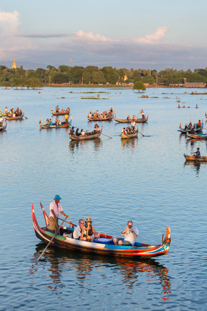 Mandalay, Myanmar - September 30, 2016: Sunset landscape with boats near famous U Bein bridge near Mandalay in Myanmarのeditorial素材