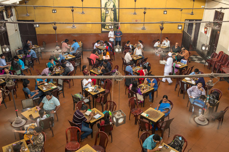 Kolkata, India - April 4, 2017: Visitors of popular Indian Coffee House having lunch in Kolkata, India. The India Coffee House chain was started by the Coffee Cess Committee in 1936 in Bombay.のeditorial素材