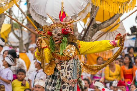 Bali, Indonesia - September 17, 2016: Unidentified balinese man performing in traditional masks during Galungan celebration in Ubud, Baliのeditorial素材