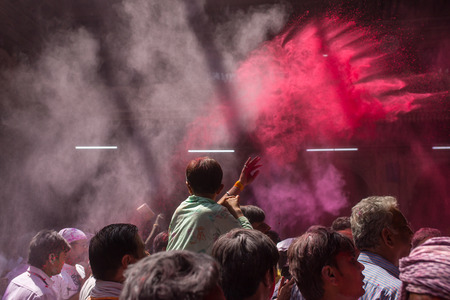 Vrindavan, India - March 19, 2016: Unidentified man sell colorful powdered dyes used for Holi...