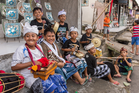 Bali, Indonesia - September 16, 2016: Balinese kids playing Barong walking on the streets of Ubud in Bali, Indonesia.のeditorial素材