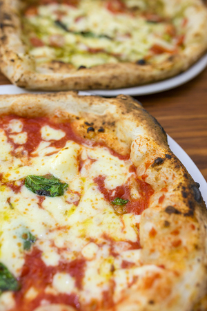 Original neapolitan pizza margherita , served in Naples restaurant, Italyの写真素材