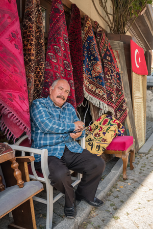 Ankara, Turkey - October 15, 2018: Portrait of an unidentified turkish carpets seller in Ankara, Turkeyのeditorial素材