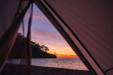 Tent lookout at beautiful dawn sky at sea coast in Turkeyの写真素材