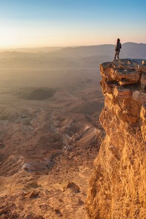 Watching sunrise in the Negev desert. Makhtesh Ramon Crater in Israelの写真素材