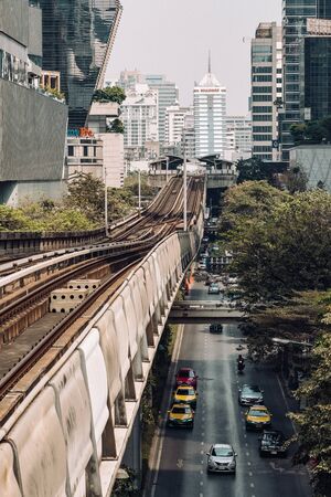 BTS skytrain is running over the busy road in Bangkok, Thailandのeditorial素材