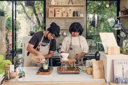 Unidentified baristas brewing coffee in modern hipster coffee shop cafe in Chiang Maiのeditorial素材