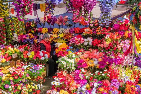 Artificial plastic flowers for sale on the eve of Orthodox holiday of Radunitsa, Brest, Belarusのeditorial素材