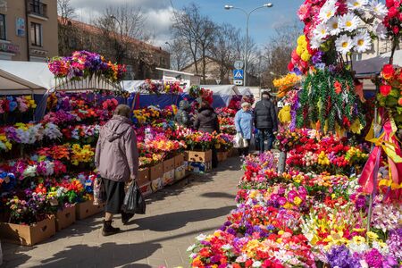 Artificial plastic flowers for sale on the eve of Orthodox holiday of Radunitsa, Brest, Belarusのeditorial素材