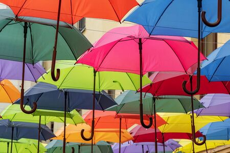 Colorful umbrellas roof over the city streetの写真素材
