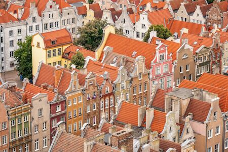 Top view of Gdansk old town with reddish tiled roofs of old town in Gdanskの写真素材