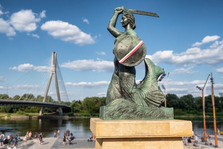 The Warsaw Mermaid called Syrenka on the Vistula River bank in Warszawaの写真素材